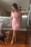 I ordered this dress in a small and a medium and ultimately kept the small. The buttons are a little difficult to get done, but I think it will get easier with wear. The fabric is thick so you don't need to wear a bra with it. I love the pockets! - Laura H.