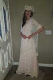 The dress is very good quality, and I am happy to have gotten it on sale. I am actually 5' 9 1/2" and in bare feet, the dress was touching the ground....and this was a small! I virtually never find formal dresses that are long enough! That said, your average height would probably find this dress too long. - Virginia G.