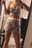 I ended up returning this but thought it was adorable. I just didn't have a place to wear it. The back is pretty much completely open. This would look great in Vegas or on a beach vacation. - Marta S.