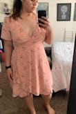 Very cute/fashionable dress - I ordered a size up since the fabric doesn't stretch completely forgetting it was a wrap dress. Neck line is a lot lower than I'd prefer, especially having a smaller chest. Exchanged for a smaller size - hoping it'll be a better fit! - Yadira H.