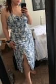 I'm in love with this dress! Super cute bodice that can be slightly tightened/loosened. Straps also have 2 positions they can be adjusted to. Slit in the leg isn't too noticeable unless you pose a certain way - still love it though! - Yadira H.