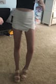 This skort is perfect! It has stretchy fabric. It's super comfortable & fits perfectly! The back is super cute as shorts too. I wish they had it in more colors! - Haley H.