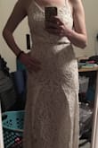 *I realized after I returned that the pictures I got were terrible, please ignore the mess*

I loved this dress online - until I put it on. I still think the dress is pretty, but ultimately I returned it. I also had a different lace design than the pictures which I wasn't a super fan of. Mine also puckered at the end of the zipper giving me a little tail - I'm sure that could have been easily fixed. - Rachael V.