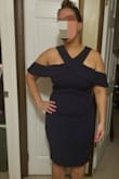 Form fitting but also has a good amount of movement/stretch. Knee length. Love the cold shoulder making it different from most common dress styles. - Jessica Z.