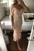 I don't know why the other reviews on this are so negative, I love this dress! It's really flattering even on an athletic body. I'm short and was expecting it to be too long, but it hits mid-shin which is great for me. It could be a little tighter, but I think the XS might not be the most comfortable for my needs.
The only slight problem is I got it for a wedding where I'll be dancing (a lot), and the sleeves make it hard to lift my arms above my shoulders. I'm going to bring it to a seamstress to have the sleeves turned into straps! - Campbell S.