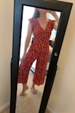 I am in love with this jumpsuit! I am short and busty, and it hits me in all the right places. You can even get away with wearing a bra because it completely covers it. The red color is so vibrant and I'm excited to wear this jumpsuit all summer! Highly recommend. - Katherine B.