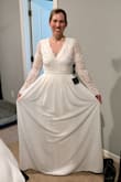 This dress is very pretty. I ended up returning it, because it wasn't what I was looking for once I tried it on. The sleeves are not fitted to your arms, but overall it still is a very pretty dress! - Mallory C.