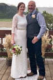 I ordered this dress for my 2nd marriage. I wanted my arms, neck & legs covered (welcome to 50). I wear a medium across the board but the medium in this dress was tight. I could get it on, but didn't feel comfortable with how my back looked. I then ordered the large and it was perfect! The lining/slip (actually it was double lined) was longer than the lace which is a no no for me so I had that shortened and I added a diamond & pearl belt. I felt amazing in this dress and had so many compliments. You cannot beat the price and it is VERY well made. 5 stars for this dress, I highly recommend! - Tracey G.