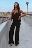 Fits perfectly for my height! Which might run long for those shorter than me, but it was so perfect and so comfortable. My favorite black jumpsuit to this day! - Melody C.