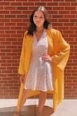 I love this dress. I wore it to graduation and my senior pictures! It photographs very nicely and does not wrinkle as much as I would expect. I would only order a smaller size because the back is very open and not on my skin. Sometimes I have to pin it back in order for it to look right. However, most of the time it works perfect! - Eliska M.