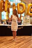 I wore this dress as my bridal shower dress. I was at the time 128lbs, and the small felt a bit snug in the waist area. Also the button was damaged up top so they sent another one in a size medium pretty fast. The medium felt much better but was loose in certain areas. I wore this dress for my nephew's baptism at 19 weeks pregnant at 142 lbs, and it definitely fit much nicer and had enough give and stretch for my little bump. Received many compliments on the dress but a bra is not an option for this dress so beware. Both pictures posted of both events. - Vanessa