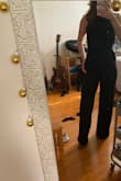 I love this jumpsuit and can't wait to wear it to my cousin's wedding in a couple weeks! I ordered this about two weeks ago in a size small, and although it's stretchy, it fit a little too snug for my liking around my waist/back. I decided to exchange it for a medium, and it's much more comfortable without compromising the style/fit. Lulus customer service is superb, and I was able to get the correct size with my original discount from my initial order! Heels are a must with this jumpsuit otherwise it will drag on the floor, but I believe it's meant for heels/wedges. The straps are comfortable and adjustable. I plan on wearing an adhesive bra as it is a backless jumpsuit. Don't pass on this one. It's a staple for anyone's closet! - Marissa A.