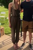 I loved this jumpsuit! The small fit perfectly and the olive color was exactly what I was looking for! The material does wrinkle easily, but it's nothing a steamer can't handle! I wore this to my brother's grad party and received many compliments. - McKenna R.