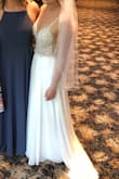 I purchased this as a wedding dress and was in love as soon as I tried it on. It fit me perfectly other than the length. I had it hemmed and left the back nearly full length and the seamstress basically created a train. It was absolutely beautiful and I got so many compliments. Wouldn't trade it for the price of a boutique dress!! - Kara C.