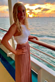 This skirt is absolutely beautiful. The material is light and flows easily. It looks stunning when paired with a white crop top as shown in the picture. The height is perfect; there was no need to get it altered. The only downside is it wrinkles very easily - bring a steamer with you if you're traveling! - Stephanie C.