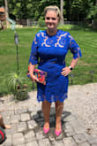 I absolutely love this dress. I needed something for a wedding that would stand out and be sophisticated enough. I usually am a solid Large (157lbs) and the XL fit perfectly. I'm large chested (40D) and as reviews mentioned it fit me perfectly and my arms have plenty of give for dancing. - Melanie H.