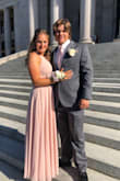 I wore this dress for prom and it was really affordable and comfortable. However, I would recommend sizing down. According to most of my measurements, I was large. If you are around my height and weight I would recommend a small because that is the one that I ended up getting after returning the large. It also shows sweat pretty easily (at least my color did). If you are planning on doing some hardcore dancing, I would go with a darker color. - Meysa H.