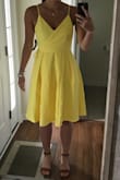 I previously purchased a large but returned for the medium shown in the photo. I am on the tall side and this dress is still long enough! The top wrap design helps fit slender tops while there is plenty of room in the skirt for wider hips. - Katie D.