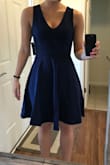 While the length was ok, the waist sat higher than my natural waist. Dress flared out more than it seems from the model picture. - Katie D.