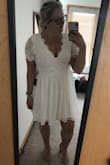 This dress met ALL my expectations!! Wonderful fabric, very well made. Very happy with how everything fit. Not tight around my arms, fits comfortably around my waist, and flowy beautiful fabric for bigger hips. Looks short in the pictures but it hits right above the knee. I adore this dress! Shown both with and without bra. Can wear it either way!! - Shannon H.