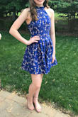 I had purchased this dress for my young daughter attending an 8th grade dance. I was very impressed with the quality and fit. The dress is fully lined and the blue fabric is very pretty. The blue color is simply beautiful. The cut of the dress and the fit are so well done that there was zero concern about any shifting, zero concern for coverage. - Nancie F.