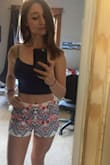 I ordered these shorts in small and in medium. At first I thought the small ones were a little short on the back because they end right where my butt ends but it fits perfectly on my waist, whereas the medium was way too wide there. Since I don't like wearing tops without a bra underneath, I didn't get the matching top but you can combine these shorts with a lot of other tops as well. I absolutely love the colors. If they were one inch longer in the back, I'd love them even more but if you're not going to an event with a bunch of old creeper guys, it's fine! - Felicia H.