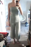 Got this for my friends rehearsal dinner. I originally ordered it in a small and returned it for a medium. I have been a small in the past for all my orders from Lulus but they have all been flowier items. I am slightly pear shaped and the small was too tight around the hips/butt/thighs. I exchanged it for a medium and it fit great. I was worried the top would be too big but you can pull the strings tighter to make it fit. - Ada B.