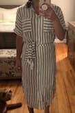 It hugs the body from the waist down, but it's looser on the top. A tad bit see-through. I will wear nude underwear or a slip with it. It can work as a dress or cover-up. - Laura D.
