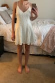 A lot of material on the skirt part of the dress, so it looks more like pleats than an empire waistline. I love the material and the buttons and the low back. It's stunning quality and looks just like the photo. I'd say go down a size though if you want a better fit! - Luana B.