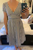 Loved the stripes and the style but it was way too constricting on (no raising your arms ladies!) and a bit matronly on. The chest was cut a little high, but it just resulted unserious cleavage, so not a total loss. The skirt is very stiff and creates a wide frame though, so not my favorite look. - Lara S.