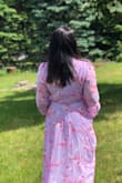 Beautiful dress. Received many compliments. I put a tank top underneath to not show my boobs. Very long. Bought a medium and it fit me perfectly. - Elisabeth P.