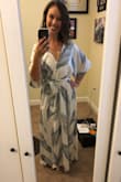 Love this dress! It's light and flowy and looks effortlessly classic. I think the button on the chest is a little high, so I leave it undone and wear a white bralette underneath. I also got the bottom hemmed as usual because I have short legs. I washed it cold, gentle and the bottom shrank up a couple inches, even though I laid it out to try. After rewatching, I had to stretch the fabric back out. I'd suggest washing it before hemming it. - Cait B.