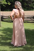 I wore this to my brother's wedding and got lots of compliments! I gain my weight in my stomach and it hid it quite well and was not tight (has some give at the back). Very good quality! I did hem it as I am short and I took the slit up a bit higher to compensate. The blush does feel like it washes you out a bit (I would definitely agree it would look better with a darker skin tone), but I still loved it! - Danielle B.