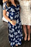 I wore this dress for my sisters bridal shower and I received so many compliments on it. The fact that it's a wrap dress also meant I could eat more and not worry about it being too tight. Also, usually maxi dresses run long on me but this one was perfect with 2-3 inch heels. - Staci S.