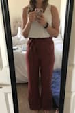 I absolutely love the marsala color and the fabric is so soft and flowy. Unfortunately, the fit is a little tight on my thighs even with a large, which usually leaves me a little room. it seems like they want to hug higher up so they can flare out at the bottom, but I'd prefer it just to be flowy all the way down like the daybreak pants Lulus also sells. 

The length was perfect for me, which was a pleasant surprise because I'm fairly tall and was ready to wear these as a crop like I normally have to, so they will probably be too long for shorter people.

I'm absolutely heart broken that they don't come in a larger size to fit my thighs loosely. I would've invested the money to have the rest tailored down, that's how awesome these look! - Christine H.