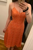 Very pretty dress. Flowy and I like the little gold detail you can only see in person. Feels weightless. - Maria S.