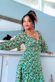 I got this dress because I was in love with the print, I read the reviews on how the neckline is too large so I sized down and it was great, I love the silky feel the material has, the print is gorgeous and yes the neck line is a little loose which is not too bad since I sized down. This is super cute for any summer events, you could even pair it with sneakers for a more causal look. This is my new favorite. - Donia M.