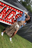 I really like the versatility of this dress! I wore it twice on two separate occasions. Once with black stiletto heels at an after 5pm party with my girls, and again with Adidas kicks at an urban music festival in London, and both looks worked! The fabric is a shiny, faux silk material with a zipper along the left lateral side of the dress for convenience. Easy to wash. Totes satisfied with my buy! - Lindsey M.