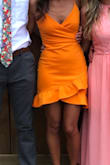 The dress was tight. I ordered based on reviews but I wouldn't change the fit. The material was thick and I didn't have to wear a bra. I love the look and bright color. - Erika M.