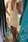 I got this to try on as an engagement party dress, but it's definitely a little more low-cut and tight than it seems in the pictures. Super flattering though, so I kept it for my bachelorette! Great material, just enough stretch and thick enough that it isn't see-through. - Lia G.
