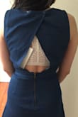 I thought the design was cute, but unlike some of the other dresses I've bought at Lulus, this jean dress did not fit me well at all. The back is super awkward looking because it's too big around the shoulder and upper torso area. There's a lot of extra room and the buttons don't help/have to be altered, so that's why the back sticks out weird the way it does in the photos. It was clearly not designed for petite people with small shoulders, so if you are 5 feet 0 inches like me, keep this in mind. Kind of disappointed to be paying $60 and then having to alter it for another $15. - Amy T.