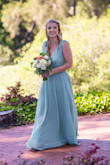 I bought this for a bridesmaid dress, and the color and fit are perfect! Very well constructed and I love the low back. There's also some adhesive on the shoulders that prevents it from slipping. It is pretty cleavage city, so I will need to pin the bust for a bit more modesty and obviously get it hemmed (short girl problems). - Emily B.