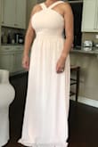 I absolutely am so impressed with how nice the fabric is and how well made it is. I ordered up based on the reviews and it fits perfect. It's long and I will have it tailored once I find the shoes I'll be wearing for my daughter's wedding. The color is not as bright as the photo. It's a softer peach which I love. I was initially concerned it would be to bright but it''s perfect. - Maria H.