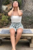 It is very fitting, super comfy, love the white color! And it'll definitely be super cute with jeans as well! - Merari N.