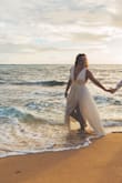 I bought this for my beach wedding. Definitely runs small and went a size up. Loved it! - Michelle G.