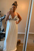 Absolutely love this dress! It is double layered so it's not see through at all. I would not recommend this dress for bigger chested girls however. There isn't a lot of support and I think wearing a bra with this dress would be very difficult to pull off. Looking forward to having it for my bachelorette party weekend! (I am having it hemmed. It is about 1 1/2 inches too long on me) - Amy H.