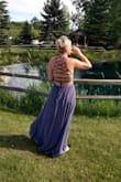 I loved this dress. I did get It hemmed since it was long, which I anticipated based on other reviews. I ordered a M. It fit great. I did use a sticky bra. - Jenny H.