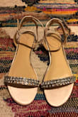 I bought these to go with the Flynn wedding dress and was so sad to find out the lace dress gets stuck on the jewels. I wore them for maybe 5 mins tops at my dress got stuck more than 6 times. So sad. Definitely pair them with a short dress. Very cute sandals but not for me. Oh and they do have a strong plastic odor.
Ps come with extra jewels - Alejandra R.