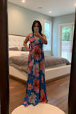 The dress is a flowy as pictured. Consider ordering a size up if you're busty; it's a true wrap dress so don't worry about the waist being too big. I ordered a small initially but the chest area was too tight. I loved it so much and am glad I ordered in a medium. The snap button probably be hold if you need to order a size up; I plan to replace it with a hook and eye clasp. - Jess M.