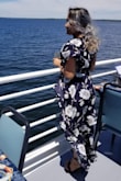 I wore 3 inch heels with this dress and wore it on a boat. Wind blew it up and around a lot but such is the price of literally being on a boat. 
Even with 3 inch heels it dragged on the floor a bit but I wouldn't return this dress for anything. I plan on wearing it to many events! - Rebecca D.